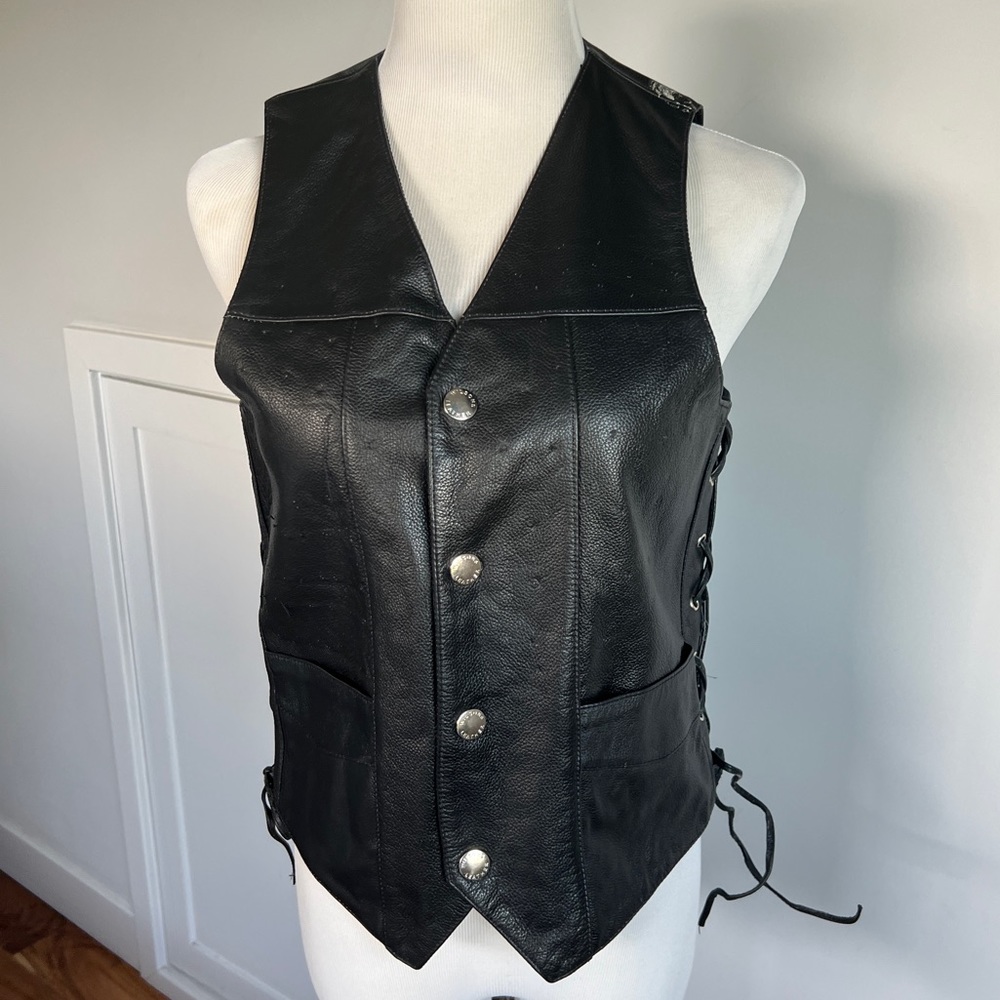 Wilson’s Leather black leather vest with braided sides purchased at CBS lot sale